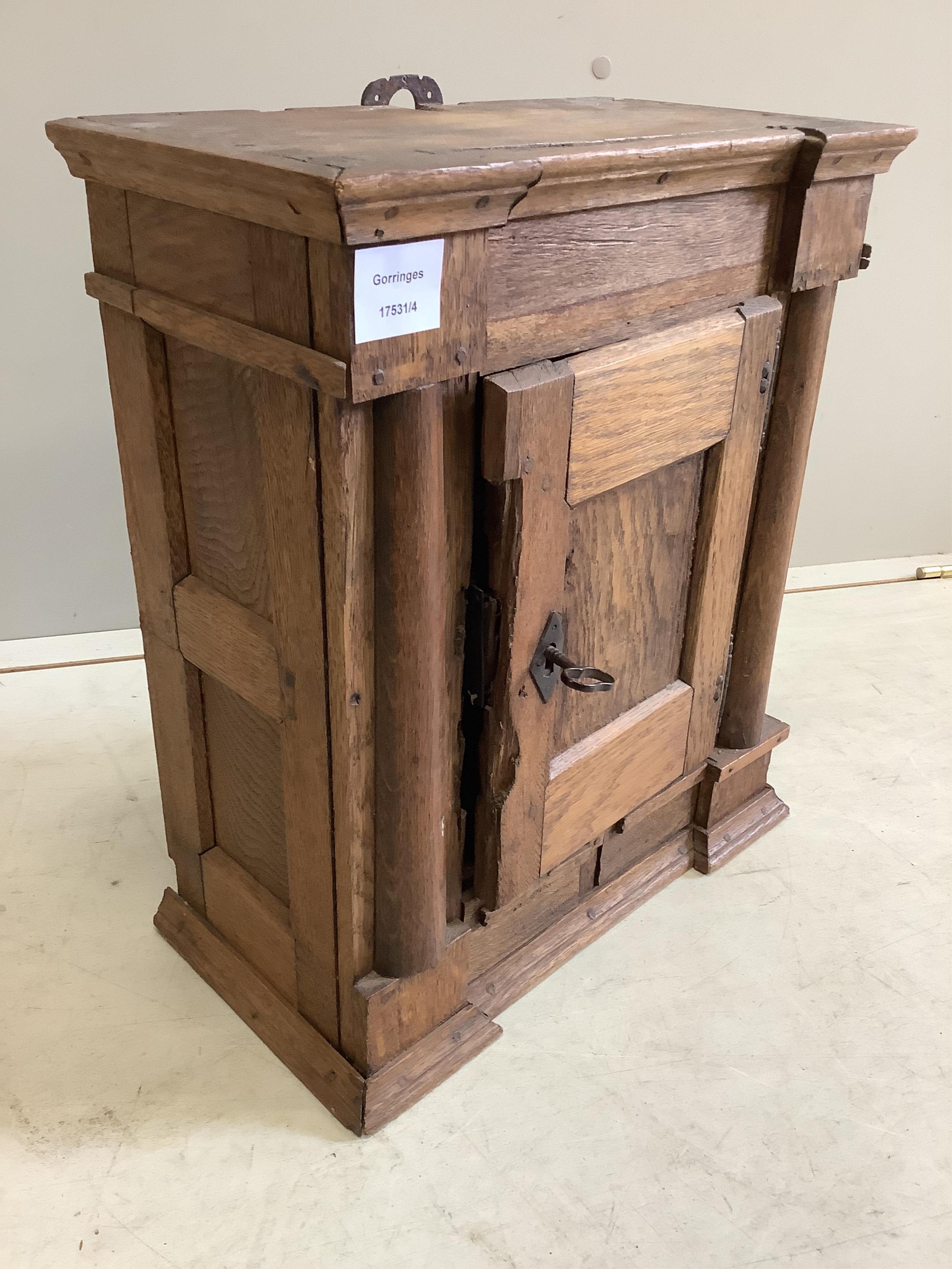 A small oak cupboard, width 38cm, depth 20cm, height 45cm
